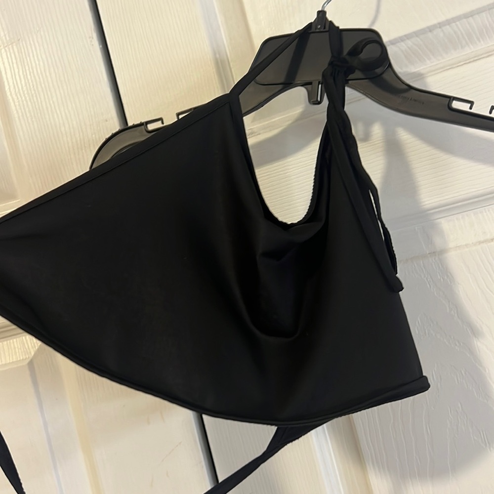 Black open back crop top.